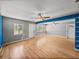 Bright living room with a ceiling fan and neutral walls at 3928 Cherry Way, Lakeland, FL 33805