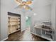 The room has gray walls, shelving unit, stainless steel sink and dark flooring at 3928 Cherry Way, Lakeland, FL 33805