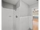 White tiled shower with standard fixtures located in the bathroom at 3928 Cherry Way, Lakeland, FL 33805