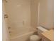 A small, white bathroom featuring a bathtub and toilet at 1219 Santos Pl, Lady Lake, FL 32159
