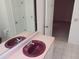 Bathroom with a vanity, mirror and doorway to another room at 1219 Santos Pl, Lady Lake, FL 32159