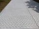 An expansive, patterned driveway and walkway lead to the home at 1219 Santos Pl, Lady Lake, FL 32159