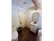 Bright bathroom with white vanity, vintage mirror, and decor accents at 18700 Ravenswood Rd, Altoona, FL 32702