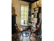 Cozy dining area featuring wood furniture, a large window, and stylish decor at 18700 Ravenswood Rd, Altoona, FL 32702