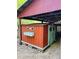Red outbuilding on blocks with green trim at 18700 Ravenswood Rd, Altoona, FL 32702