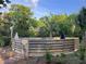 Backyard pool featuring wood fence and brick pathway at 18700 Ravenswood Rd, Altoona, FL 32702