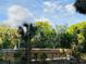 Backyard pool enclosed by a modern, light wood fence at 18700 Ravenswood Rd, Altoona, FL 32702