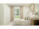Bright bedroom with a modern bed, complemented by large windows and a view of the lush outdoor landscape at 4734 Bold Peacock Bnd, Bartow, FL 33830