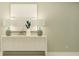 Modern living area with a sleek console table and decorative lamps creating a warm and inviting ambiance at 4734 Bold Peacock Bnd, Bartow, FL 33830