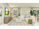 Inviting living room boasts a large sectional, modern decor, and an abundance of natural light for a welcoming ambiance at 4734 Bold Peacock Bnd, Bartow, FL 33830