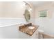 Well-lit bathroom with a granite countertop and tile flooring at 933 W Queen St, Lakeland, FL 33803