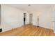 Bedroom featuring hardwood floors and a closet with sliding doors at 933 W Queen St, Lakeland, FL 33803