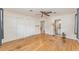 Expansive bedroom with hardwood flooring, closet, and ensuite bathroom access at 933 W Queen St, Lakeland, FL 33803
