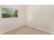 Cozy bedroom with tile flooring and a window providing natural light at 933 W Queen St, Lakeland, FL 33803