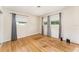 Bedroom featuring hardwood floors and gray curtains on the windows at 933 W Queen St, Lakeland, FL 33803