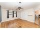 Bedroom with hardwood floors, ceiling fan, and natural light from the windows at 933 W Queen St, Lakeland, FL 33803