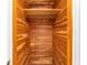 Wood plank lined closet with shelving and a clothing rod at 933 W Queen St, Lakeland, FL 33803