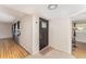 Inviting entryway with tiled floor and a secure front door at 933 W Queen St, Lakeland, FL 33803