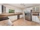 Modern kitchen featuring stainless steel appliances and white cabinets, offering a sleek design at 933 W Queen St, Lakeland, FL 33803