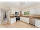 Bright kitchen features stainless steel appliances and granite countertops at 933 W Queen St, Lakeland, FL 33803