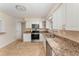 Well-equipped kitchen with granite countertops, stainless steel appliances, and ample cabinet space at 933 W Queen St, Lakeland, FL 33803