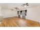 Large living room with hardwood floors and ample natural light streaming through the windows at 933 W Queen St, Lakeland, FL 33803