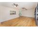Spacious living room featuring hardwood floors and great lighting, ideal for Gathering gatherings at 933 W Queen St, Lakeland, FL 33803