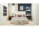 Well-lit bedroom featuring neutral tones, study area and stylish furniture at 971 Hour Glass Rd, Lakeland, FL 33801