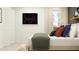 Cozy bedroom featuring decorative pillows, sporty wall art, and a window at 971 Hour Glass Rd, Lakeland, FL 33801