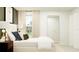 Bright bedroom featuring a large window and a decorative full-length mirror at 971 Hour Glass Rd, Lakeland, FL 33801