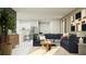 Spacious living area featuring a comfortable sofa, stylish decor, and an open-concept design at 971 Hour Glass Rd, Lakeland, FL 33801