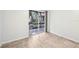 Bedroom with tile flooring featuring sliding glass doors to lanai, blending indoor comfort with outdoor accessibility at 490 N Pin Oak Pl # 112, Longwood, FL 32779