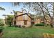 Exterior angle of a brick and sided condo with screened in porches and mature landscaping at 490 N Pin Oak Pl # 112, Longwood, FL 32779