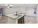 Beautiful kitchen with a granite topped center island, stainless steel dishwasher and tile flooring at 490 N Pin Oak Pl # 112, Longwood, FL 32779