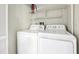 Functional laundry room with modern washer and dryer, maximizing efficiency and convenience for everyday tasks at 490 N Pin Oak Pl # 112, Longwood, FL 32779