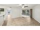 Bright living room with sliding glass doors to the outdoor patio, showing tiled flooring throughout at 490 N Pin Oak Pl # 112, Longwood, FL 32779
