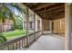 Lovely screened in patio showcasing a wood ceiling, outdoor seating and a view of the lush green outdoors at 490 N Pin Oak Pl # 112, Longwood, FL 32779