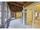 A spacious screened in patio with a wood plank ceiling, sliding glass doors and a view of the outdoors at 490 N Pin Oak Pl # 112, Longwood, FL 32779