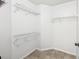 This walk-in closet features a spacious layout and ample shelving for optimum storage and organization at 490 N Pin Oak Pl # 112, Longwood, FL 32779