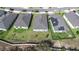 An aerial shot displaying the backyards of multiple homes, emphasizing space and community layout at 670 Campo Ln, Davenport, FL 33837