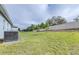 The generous backyard is enclosed by a white fence for privacy and security at 670 Campo Ln, Davenport, FL 33837