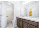 Bright bathroom features a shower, double vanity, and lots of natural light at 670 Campo Ln, Davenport, FL 33837