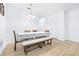 Bright dining room with modern lighting, dining table, and light wood floors at 670 Campo Ln, Davenport, FL 33837