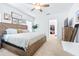 Spacious main bedroom with lots of natural light, neutral walls, and a ceiling fan at 670 Campo Ln, Davenport, FL 33837