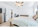 Spacious main bedroom with lots of natural light, neutral walls, and a ceiling fan at 670 Campo Ln, Davenport, FL 33837