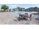 Community pool area featuring comfortable lounge chairs and a fun splash fountain at 670 Campo Ln, Davenport, FL 33837