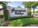 The community sign is surrounded by lush landscaping at 670 Campo Ln, Davenport, FL 33837