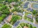 An aerial view shows the property, pool and landscaping in a well-maintained suburban neighborhood at 114 Valencia Loop, Altamonte Springs, FL 32714