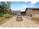 Inviting backyard featuring a stone fire pit, perfect for outdoor gathering and relaxing at 114 Valencia Loop, Altamonte Springs, FL 32714