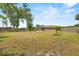 The spacious backyard offers mature trees, lush lawns and an area for entertaining and recreation at 114 Valencia Loop, Altamonte Springs, FL 32714